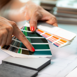 Interior designer matching color samples. Choosing compact boards and color palette material samples